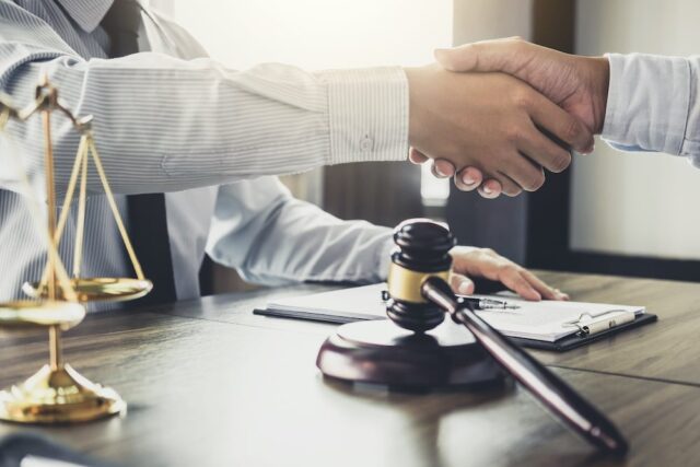 attorney and client shaking hands